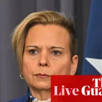 Australia news live: Asio warns politicians that internet-connected cars could be bugged; flood warnings after wild weather